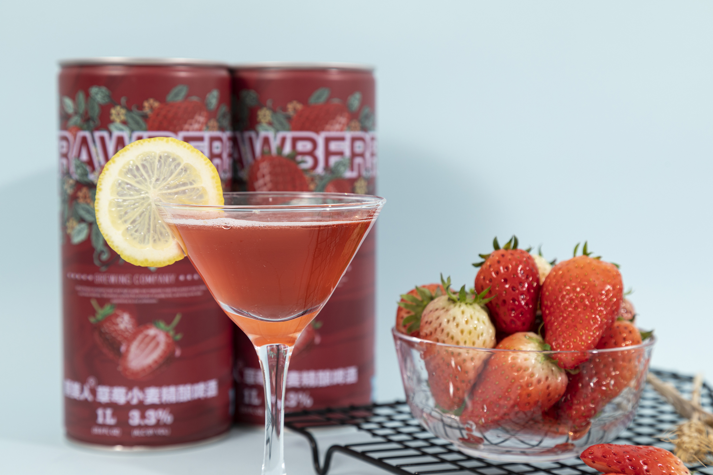 Golden clear liquid of strawberry fruit beer with dense foam